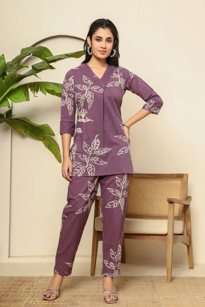 Stylish women's co-ord set in purple with leaf prints, featuring a tunic and matching pants